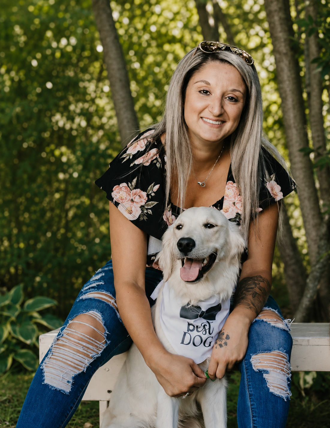 Samantha Pronovost sitting outdoors with her dog